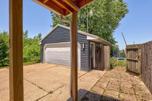 5255 E Holland Rd, Saginaw, MI 48601 - detached garage featuring a trampoline
