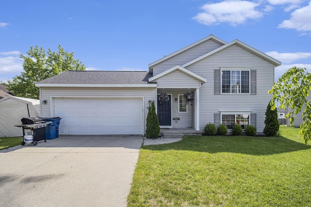 613 Silver Birch St, Howard City, MI 49329 - tri-level home with concrete driveway, a garage, and a front lawn