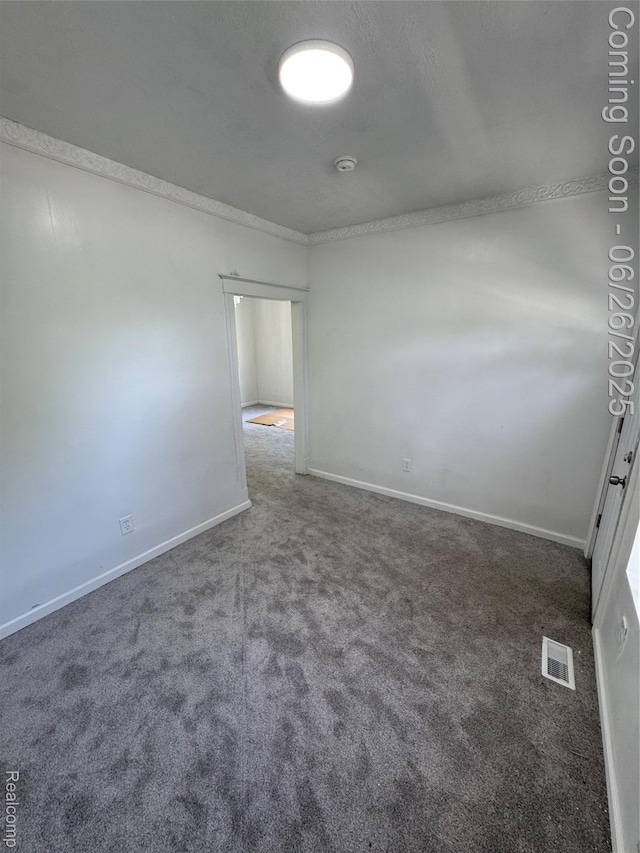 2063 Meade St, Hamtramck, MI 48212 - carpeted spare room featuring baseboards and a smoke detector