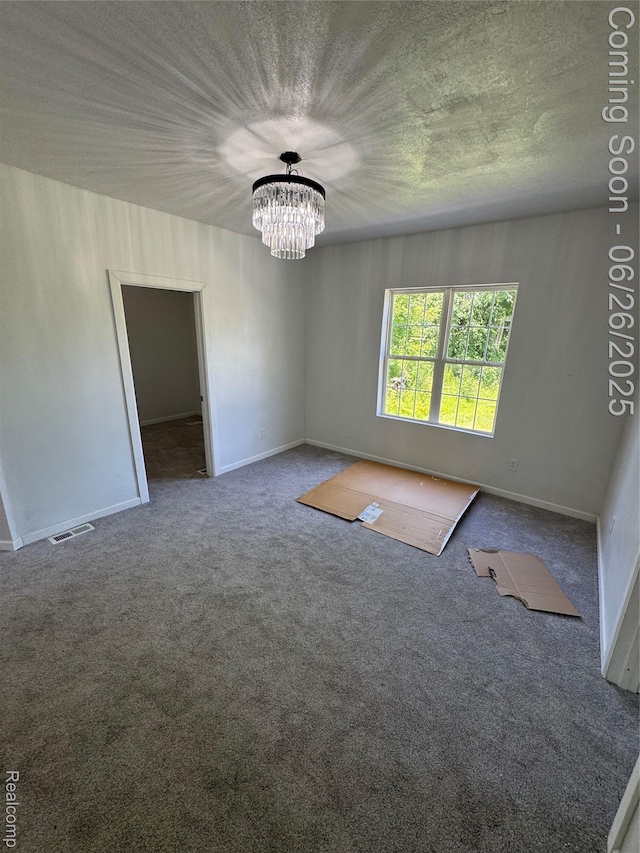 2063 Meade St, Hamtramck, MI 48212 - carpeted spare room featuring a chandelier and baseboards