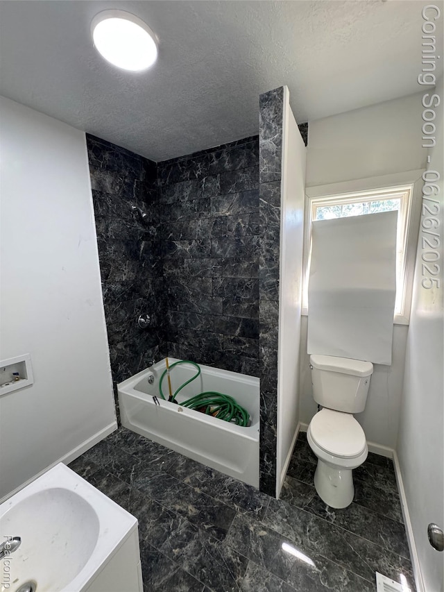2063 Meade St, Hamtramck, MI 48212 - bathroom featuring shower / washtub combination and a textured ceiling
