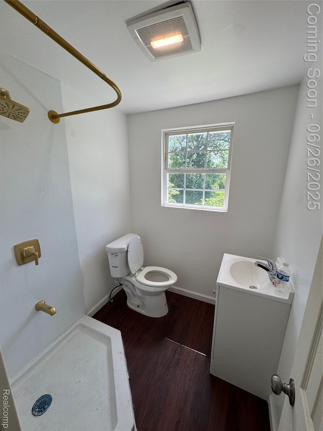 2063 Meade St, Hamtramck, MI 48212 - full bathroom with wood finished floors, vanity, and a shower
