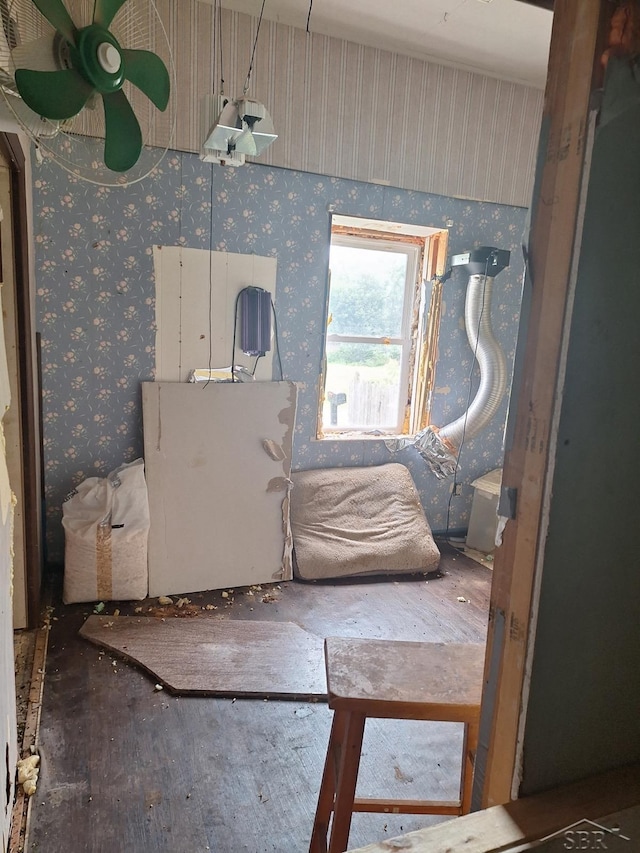 401 W Main Rd, Cement City, MI 49233 - bedroom with wood finished floors and wallpapered walls