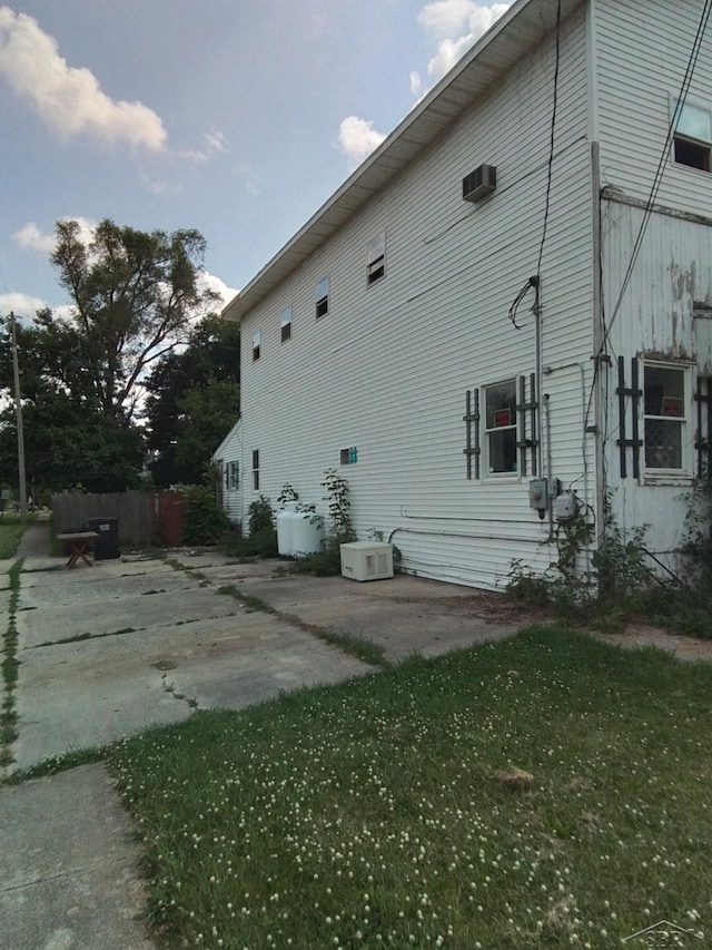401 W Main Rd, Cement City, MI 49233 - view of property exterior featuring a patio and a wall mounted AC