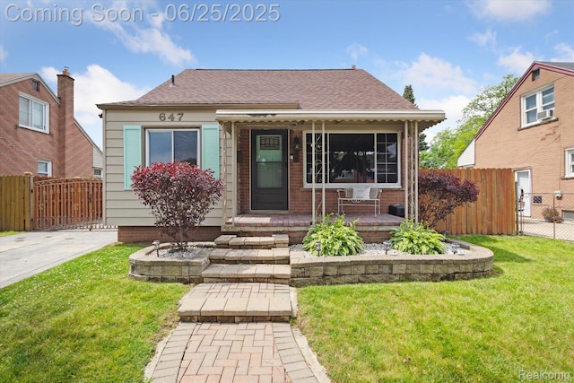 647 Farnham Ave, Lincoln Park, MI 48146 - view of front of house with a shingled roof and a porch