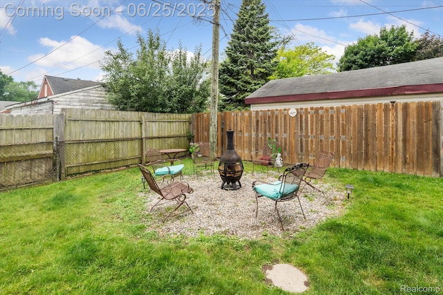 647 Farnham Ave, Lincoln Park, MI 48146 - fenced backyard featuring an outdoor fire pit