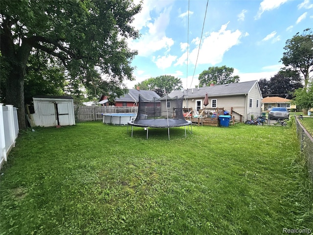356 Spruce St, Mount Morris, MI 48458 - fenced backyard with a shed and a deck