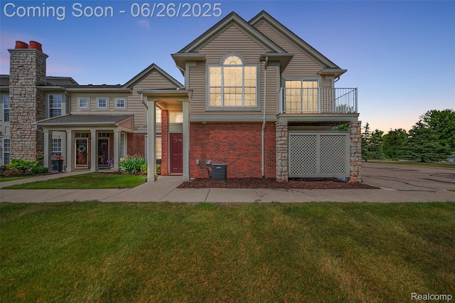 21958 Hartford Way, Macomb, MI 48042 - view of front of property with a lawn and brick siding