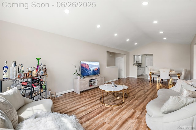 21958 Hartford Way, Macomb, MI 48042 - living area with light wood finished floors, vaulted ceiling, and recessed lighting