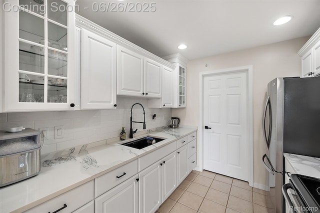 21958 Hartford Way, Macomb, MI 48042 - kitchen featuring stainless steel appliances, white cabinets, decorative backsplash, glass insert cabinets, and light tile patterned flooring