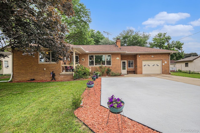 2126 Covert Rd, Burton, MI 48509 - ranch-style house featuring driveway, a garage, a chimney, brick siding, and a front yard