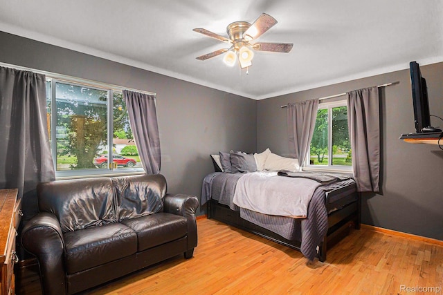2126 Covert Rd, Burton, MI 48509 - bedroom featuring light wood finished floors and a ceiling fan