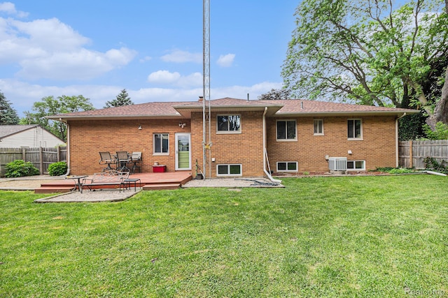 2126 Covert Rd, Burton, MI 48509 - rear view of house with a wooden deck and brick siding