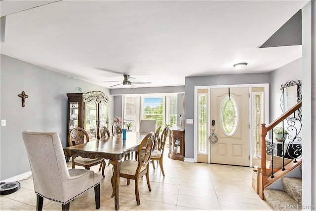 7471 Brewer Rd, Flint, MI 48507 - dining room featuring stairway, a ceiling fan, and light tile patterned floors