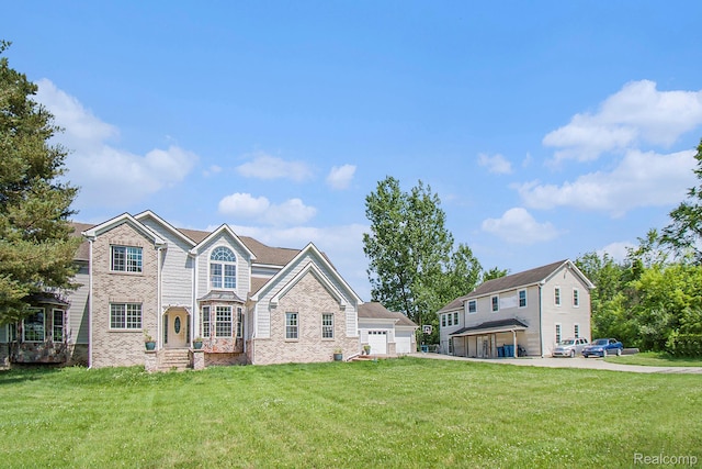 7471 Brewer Rd, Flint, MI 48507 - view of front of house with a front yard and brick siding