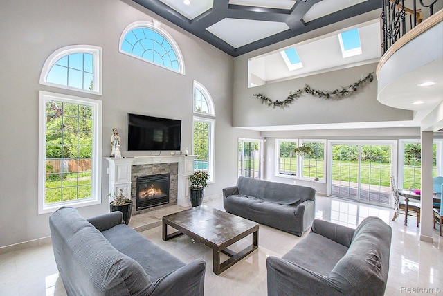 7471 Brewer Rd, Flint, MI 48507 - living room with a high ceiling, a fireplace, and light tile patterned flooring