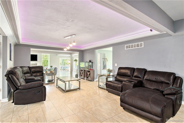7471 Brewer Rd, Flint, MI 48507 - living area featuring a raised ceiling, light tile patterned floors, and a textured ceiling