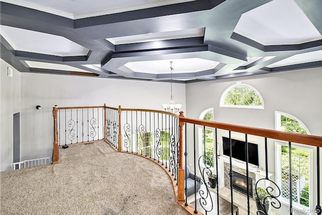 7471 Brewer Rd, Flint, MI 48507 - corridor with a chandelier, carpet floors, coffered ceiling, and ornamental molding