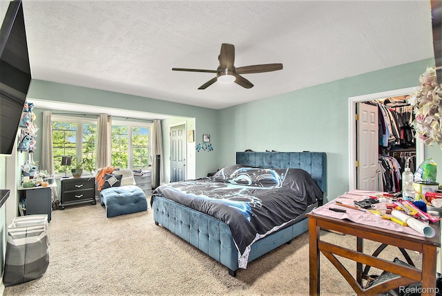 7471 Brewer Rd, Flint, MI 48507 - bedroom featuring carpet floors, ceiling fan, and a textured ceiling