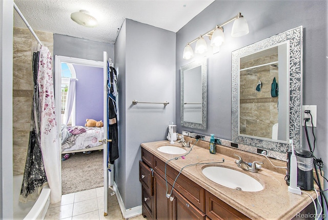 7471 Brewer Rd, Flint, MI 48507 - ensuite bathroom featuring double vanity, tile patterned floors, and a textured ceiling