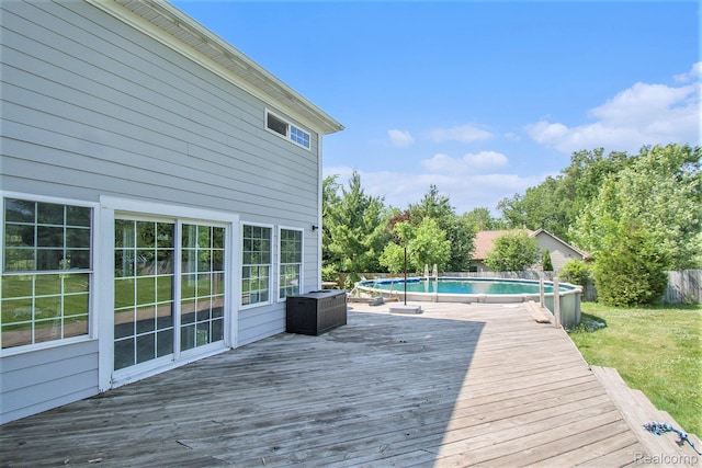 7471 Brewer Rd, Flint, MI 48507 - wooden deck featuring an outdoor pool
