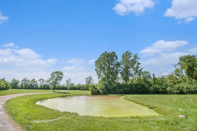 7471 Brewer Rd, Flint, MI 48507 - view of community with a lawn and a water view