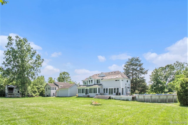 7471 Brewer Rd, Flint, MI 48507 - view of grassy yard with an outdoor pool
