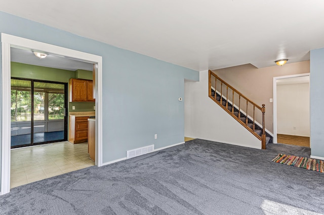 771 S Venoy Rd, Westland, MI 48186 - unfurnished living room with light carpet and stairs