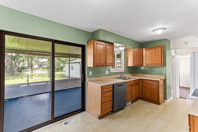 771 S Venoy Rd, Westland, MI 48186 - kitchen featuring dishwasher, light countertops, brown cabinets, and range