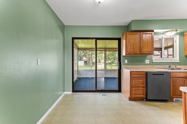 771 S Venoy Rd, Westland, MI 48186 - kitchen with dishwasher, brown cabinetry, and light countertops