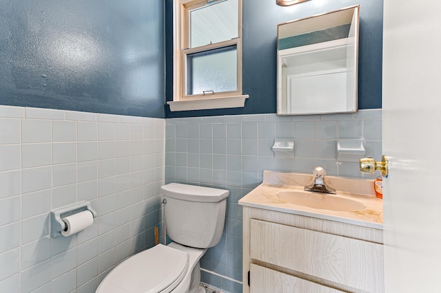 771 S Venoy Rd, Westland, MI 48186 - bathroom featuring tile walls, vanity, and wainscoting