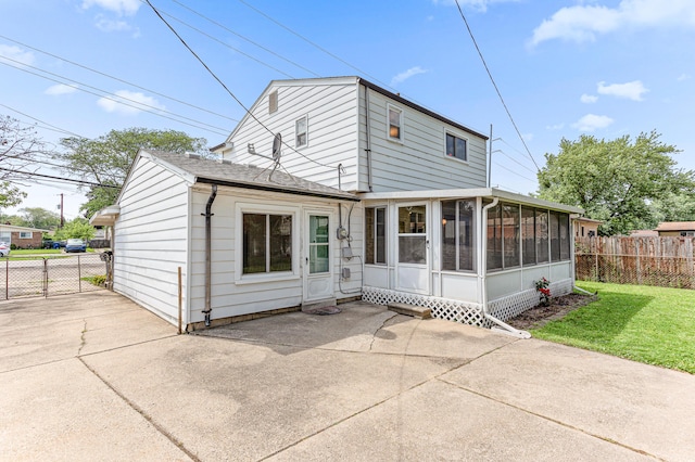 771 S Venoy Rd, Westland, MI 48186 - rear view of house with a sunroom, a patio area, and a shingled roof