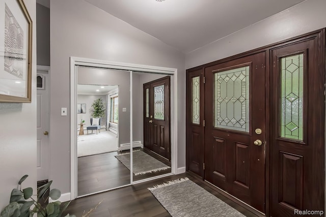 4290 Frostwood, Troy, MI 48098 - foyer entrance featuring vaulted ceiling, a baseboard radiator, and wood finished floors