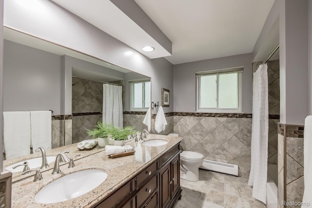 4290 Frostwood, Troy, MI 48098 - bathroom featuring a baseboard radiator, tile walls, double vanity, and wainscoting