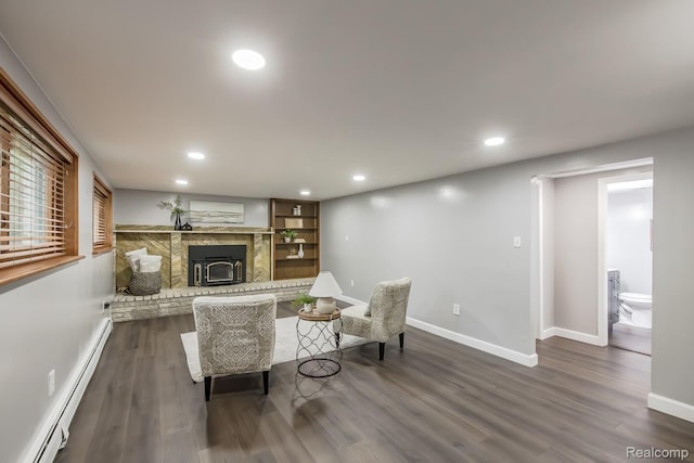4290 Frostwood, Troy, MI 48098 - living room with a baseboard radiator, a brick fireplace, dark wood-style floors, and recessed lighting