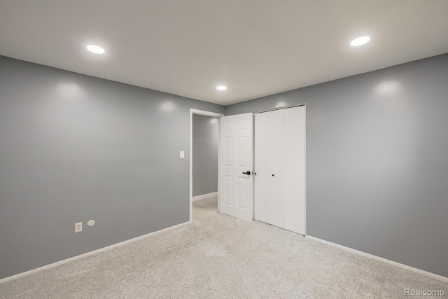 4290 Frostwood, Troy, MI 48098 - unfurnished bedroom featuring light carpet, recessed lighting, and a closet