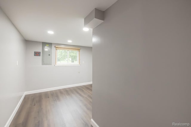 4290 Frostwood, Troy, MI 48098 - spare room featuring electric panel, wood finished floors, and recessed lighting