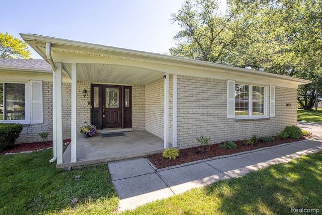 4290 Frostwood, Troy, MI 48098 - entrance to property featuring brick siding and a porch