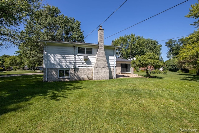 4290 Frostwood, Troy, MI 48098 - rear view of property featuring a chimney and a lawn