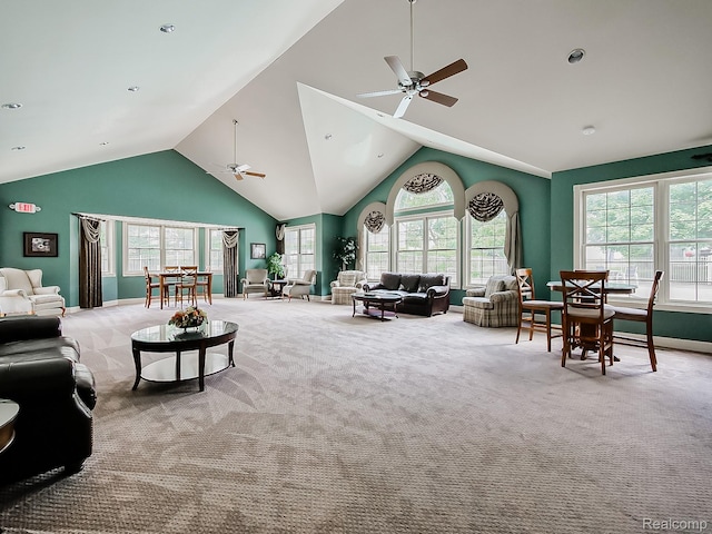 229 Brookwood Dr Unit 9, South Lyon, MI 48178 - carpeted living room featuring a ceiling fan, vaulted ceiling, and plenty of natural light