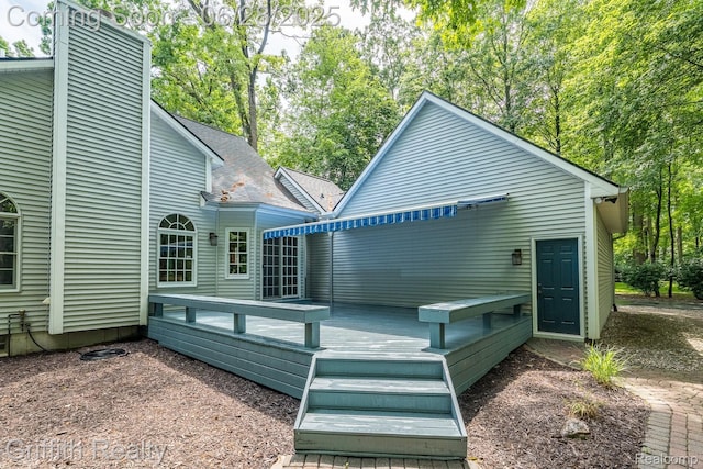 8123 Baypointe Dr, Brighton, MI 48114 - back of house featuring a wooden deck