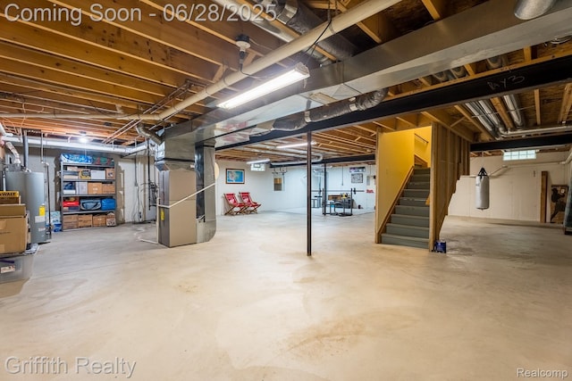 8123 Baypointe Dr, Brighton, MI 48114 - below grade area with gas water heater, stairs, and heating unit