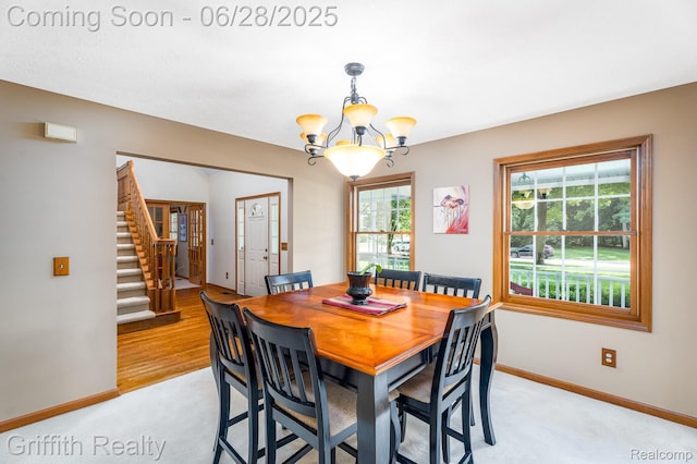 8123 Baypointe Dr, Brighton, MI 48114 - dining room with a chandelier and stairway
