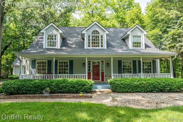 8123 Baypointe Dr, Brighton, MI 48114 - cape cod home featuring a porch and a shingled roof