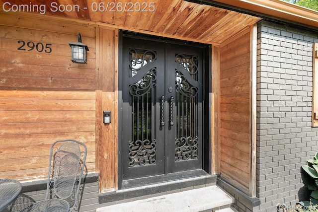 2905 Lahser Rd, Bloomfield Hills, MI 48304 - view of exterior entry with french doors and brick siding