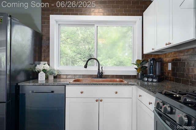 2905 Lahser Rd, Bloomfield Hills, MI 48304 - kitchen with dishwasher, white cabinetry, tasteful backsplash, freestanding refrigerator, and stainless steel gas range oven