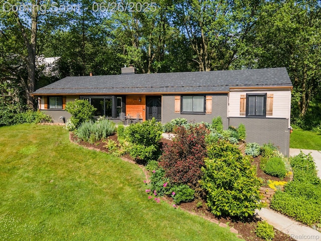 2905 Lahser Rd, Bloomfield Hills, MI 48304 - ranch-style home with a chimney, a front yard, and brick siding