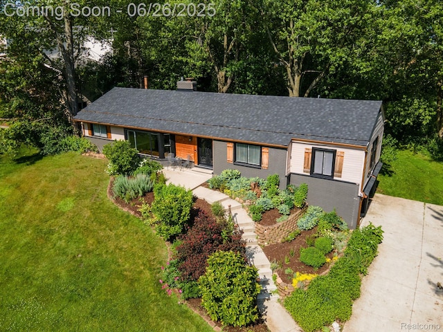 2905 Lahser Rd, Bloomfield Hills, MI 48304 - view of front of property with a front lawn, brick siding, and a shingled roof