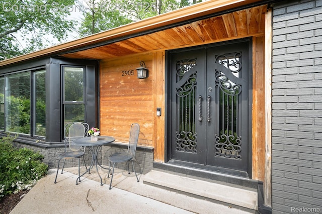 2905 Lahser Rd, Bloomfield Hills, MI 48304 - view of exterior entry with french doors and brick siding