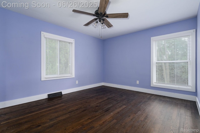 2905 Lahser Rd, Bloomfield Hills, MI 48304 - empty room featuring plenty of natural light, a ceiling fan, and dark wood finished floors